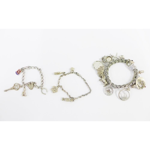 21 - Three silver charm bracelets (3)