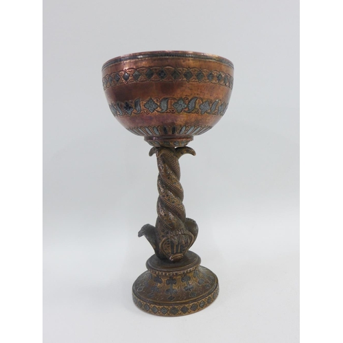 59 - Heavy cast Persian copper and white metal inlaid goblet on a serpent stem and circular footrim, 20cm... 