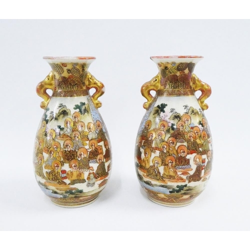 123 - Pair of Japanese Satsuma earthenware vases, with gild handles and painted with figures, character ma... 