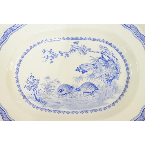 135 - Furnival's Quail pattern blue and white table wares to include three graduated ashets and a sauce bo... 