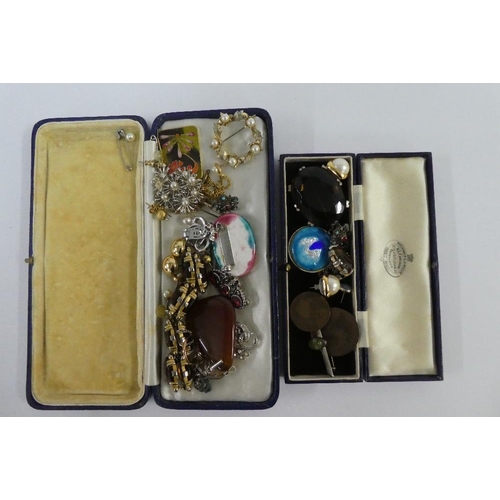 15 - A collection of costume jewellery to include brooches, necklaces, earrings and a silver medallion, e... 