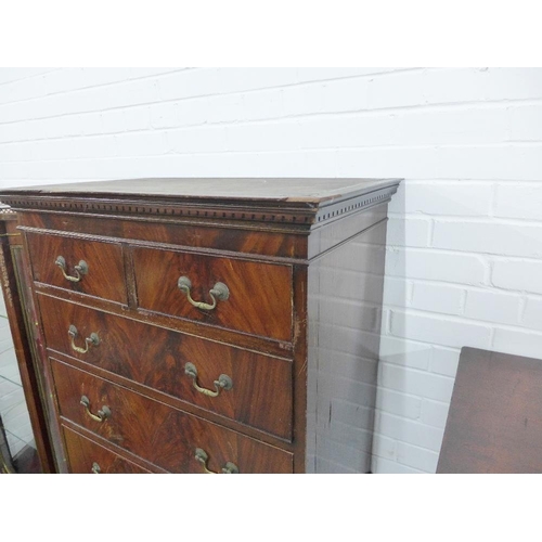 205 - Mahogany veneered tallboy chest with a dentil frieze over two short and six long drawers, on bracket... 