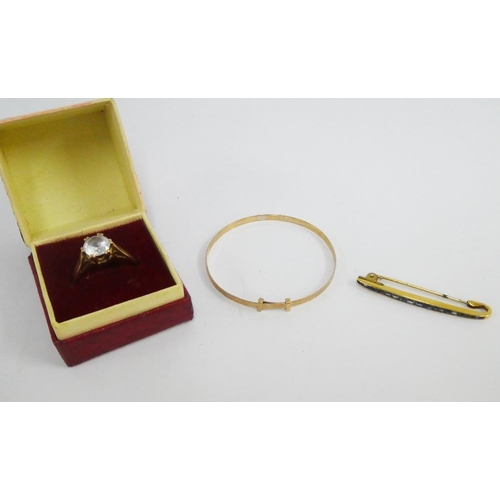21 - 9ct gold ring, child's 9ct gold bangle and a yellow metal gemset bar brooch, (3)