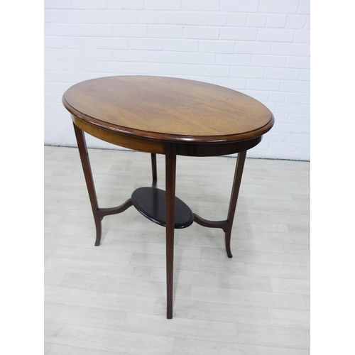 223 - Edwardian mahogany two tier occasional table with oval top, 75 x 77cm