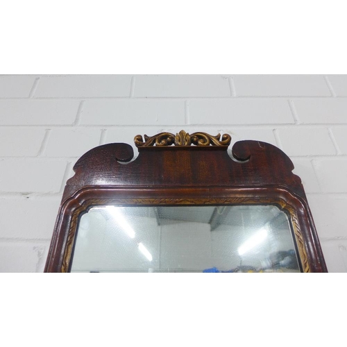 253 - Mahogany and parcel gilt wall mirror, 72 x 39cm