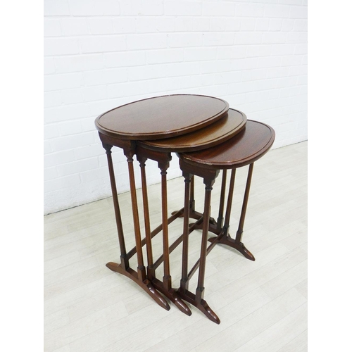 262 - Mahogany nest of three tables with oval tops, (3) 68 x 52cm