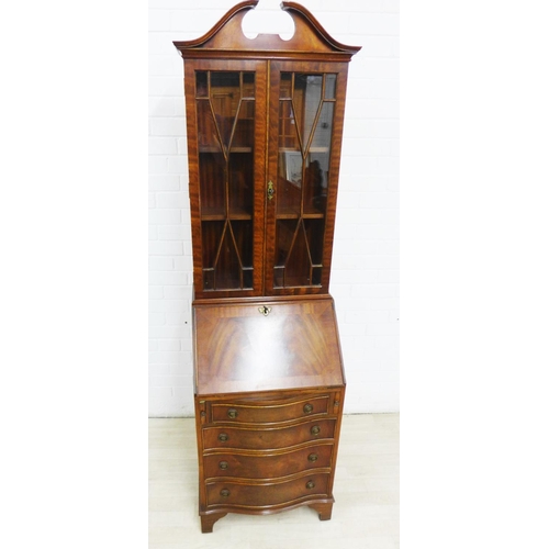 275 - Mahogany veneered bureau bookcase with a broken swan neck pediment over a pair of glazed cupboards w... 