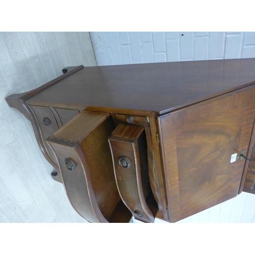 275 - Mahogany veneered bureau bookcase with a broken swan neck pediment over a pair of glazed cupboards w... 