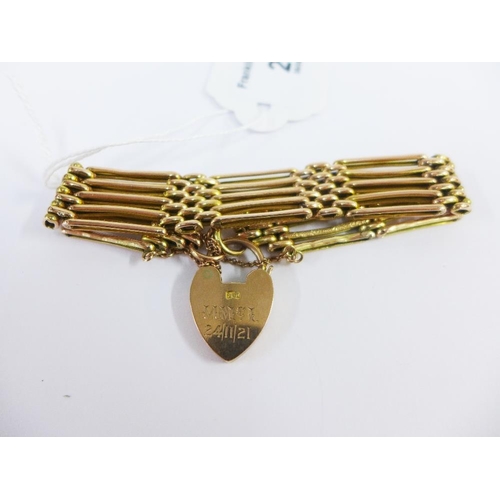 28 - 9ct gold five bar gate link bracelet with a heart padlock, stamped 9ct