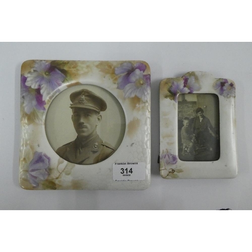 314 - Two early 20th century floral patterned photograph frames together with a Burleigh purple glazed dre... 