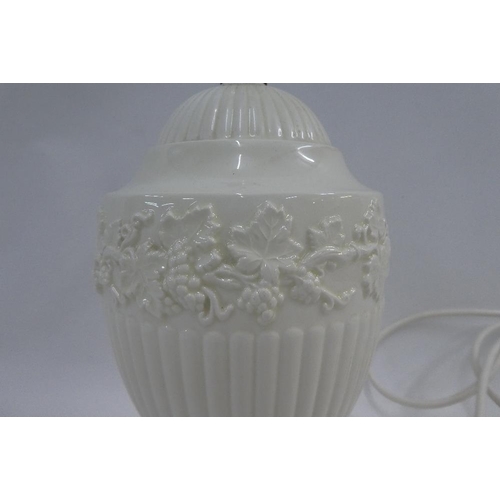 318 - Wedgwood Creamware table lamp base of classical urn shape with a fruit and vine moulded border, 30cm... 