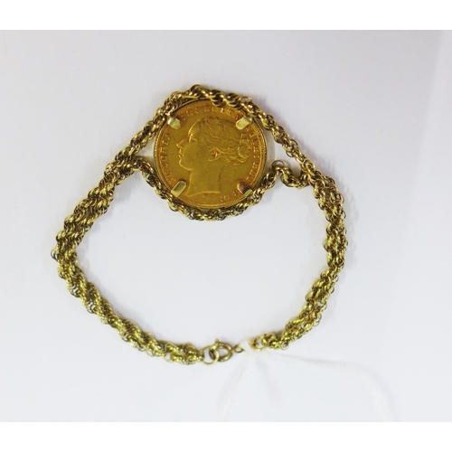 33 - Queen Victoria gold sovereign 1874 in a 9ct gold mount and bracelet