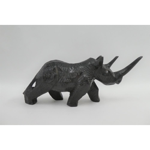 333 - Collection of wooden items to include a rhinoceros, figures and monkeys, etc (8)