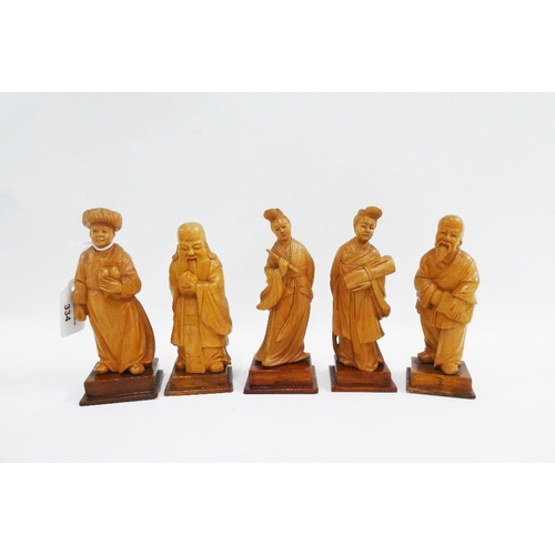 334 - Set of five carved fruitwood chinoiserie figures, on square bases, tallest 15cm (5)