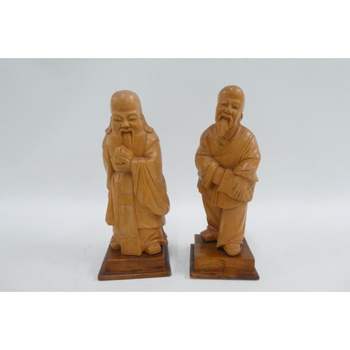 334 - Set of five carved fruitwood chinoiserie figures, on square bases, tallest 15cm (5)