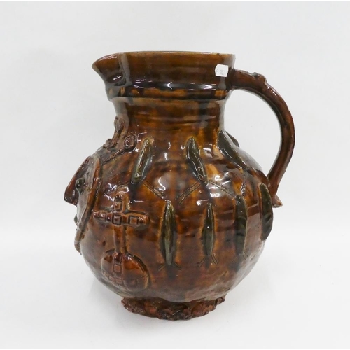 344 - Brown glazed pottery jug with moulded heart shape face and religious motifs throughout, apparently u... 