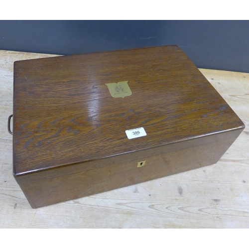 386 - Early 20th century oak canteen containing a suite of Epns flatwares, over three trays, retailed by B... 