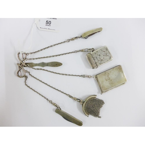 50 - Continental silver chatelaine hung with a Birmingham silver vesta case, two white metal fruit / pen ... 