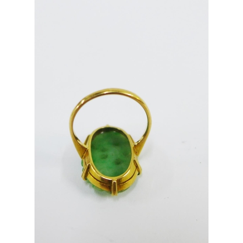 56 - 18ct gold ring claw set with a jade floral carved plaque, UK ring size M together with a strand of g... 