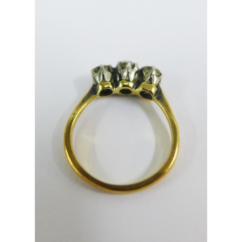 58 - 18ct gold diamond ring, claw set with three bright cut diamonds, stamped 18ct