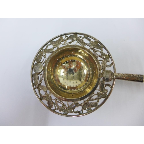 70 - Chinese silver tea strainer, the pierced bowl with butterfly pattern border and with a carved jade h... 