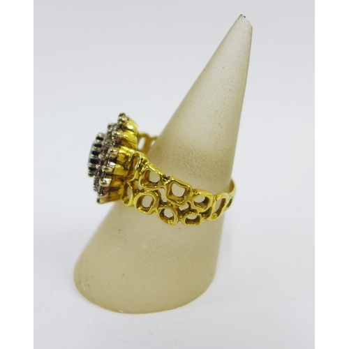 94 - 18ct gold diamond and gemset cocktail ring, with an pierced band, stamped 750 UK size U,  approx 8.5... 