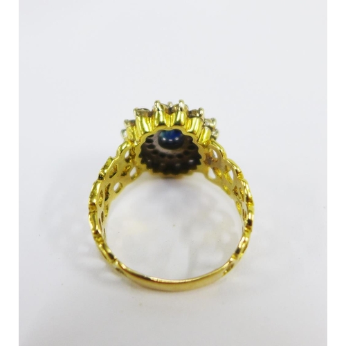 94 - 18ct gold diamond and gemset cocktail ring, with an pierced band, stamped 750 UK size U,  approx 8.5... 