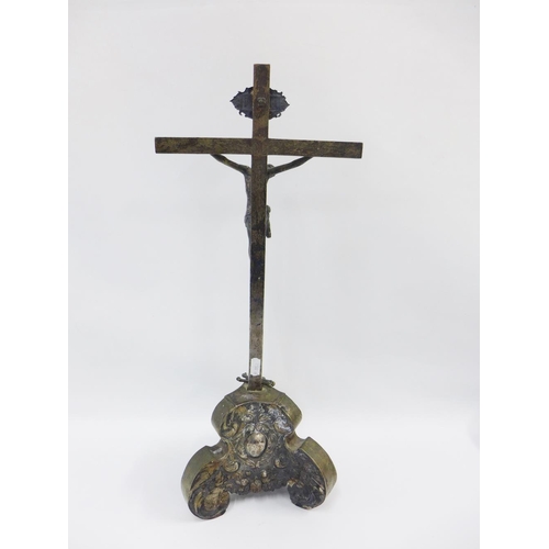 97 - Early continental silver Corpus Christi Cavalry Crucifix, with Baroque base surmounted by skull and ... 