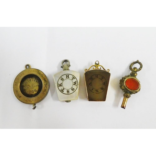 103 - Victorian Masonic gold mounted fob together with another and Masonic medallion and watch key (a lot)