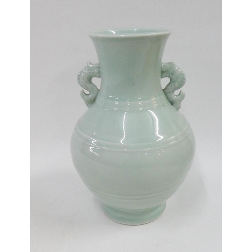 129 - Celadon glazed vase with seahorse handles to side, 26cm high