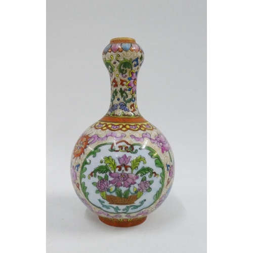 131 - Chinese vases with garlic mouth, painted with flowers in polychrome enamels, with a red Qianlong sea... 