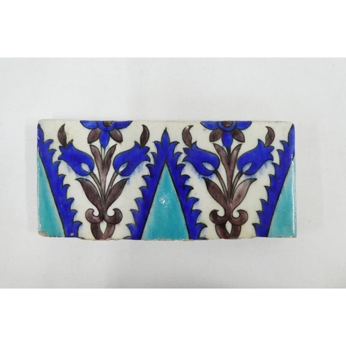 145 - Iznik style tile, likely 19th century, with green, white and blue floral motif, 23.5 x 11cm