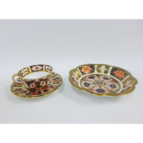 149 - Royal Crown Derby Imari 2451 pattern cup, saucer and side plate trio together with a Royal Crown Der... 