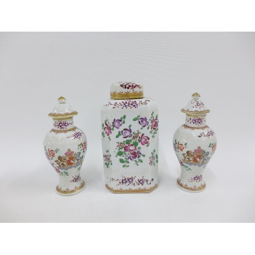 161 - A group of Samson Armorial porcelains to include a tea caddy and cover and a pair of covered baluste... 