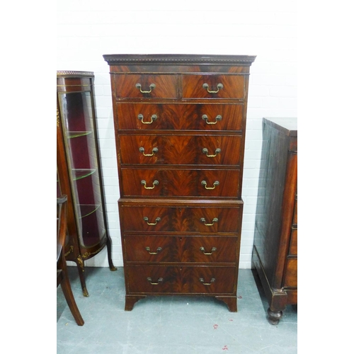 205 - Mahogany veneered tallboy chest with a dentil frieze over two short and six long drawers, on bracket... 