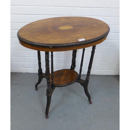 211 - Edwardian rosewood and inlaid two tier occasional table with an oval top, turned legs and castors 71... 