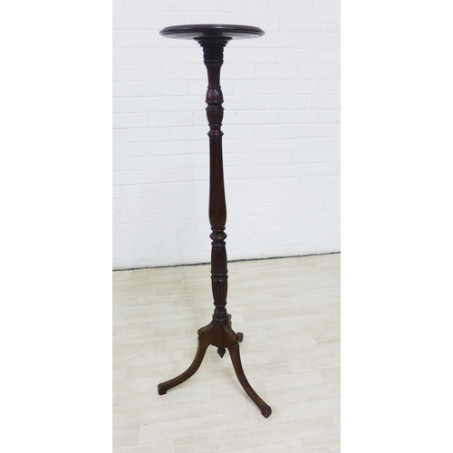 225 - Mahogany torchere, on baluster turned column and with tripod legs, 123cm