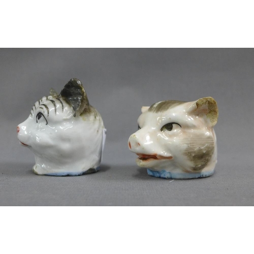 61 - Two 19th century Staffordshire animal head money banks,one of a cat the other of a pig, 5cm high  (2... 