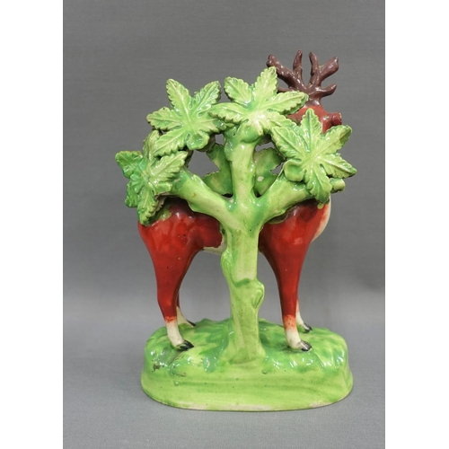 89 - 19th century Staffordshire red deer and boacage pottery figure, 20cm high