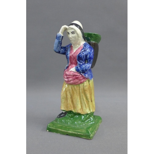 59 - Early 19th century earthenware figure of a fishwife, probably from Thomas Rathbone's factory, Portob... 