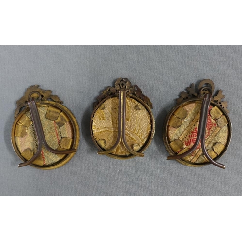 353 - Three portrait miniatures on ivory to include Gaby, Loty and Fausta, contained in circular brass sta... 