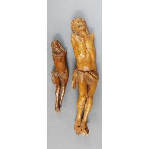 362 - Flemish carved fruitwood figure of Christ and another of smaller size, longest 29cm (2)