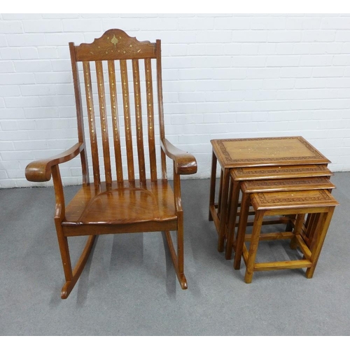 439 - Eastern hardwood and mixed metal inlaid rocking chair, 110 x 63cm, and a nest of four tables, (2)