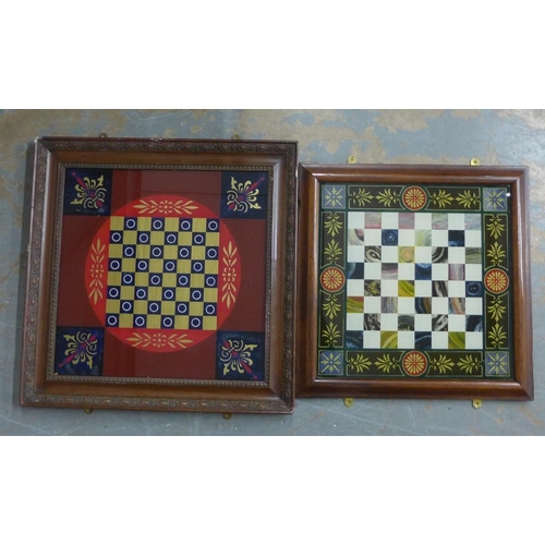 445 - Verre eglomise chess board with red ground and gilt acanthus motifs, together with another smaller w... 