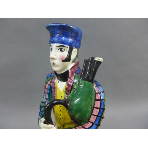 64 - Early 19th century Portobello pottery figure of a Bagpiper, modelled standing in his tartan jacket a... 