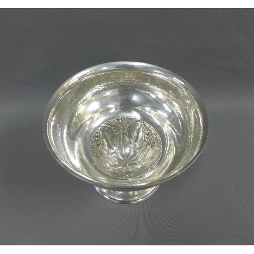 14 - Swedish planished silver bowl with leaf and grape pattern, on a spreading circular footrim, 24 x 18c... 