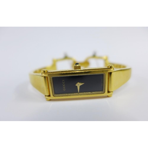 27 - Lady's Gucci gold plated wrist watch