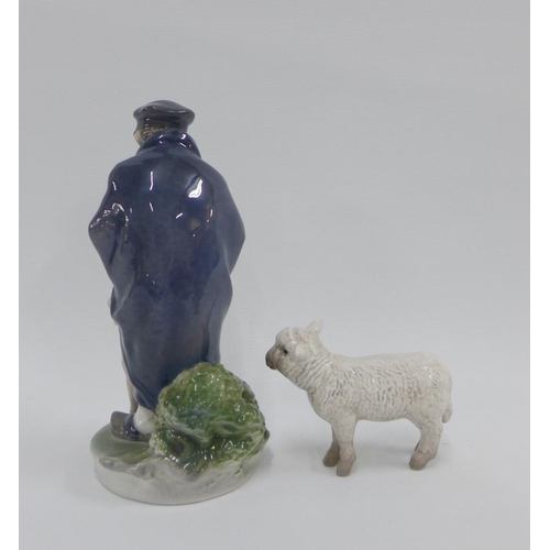 103 - Royal Copenhagen porcelain figure of a boy with his dog, model number 782 and a Bing & Grondahl porc... 