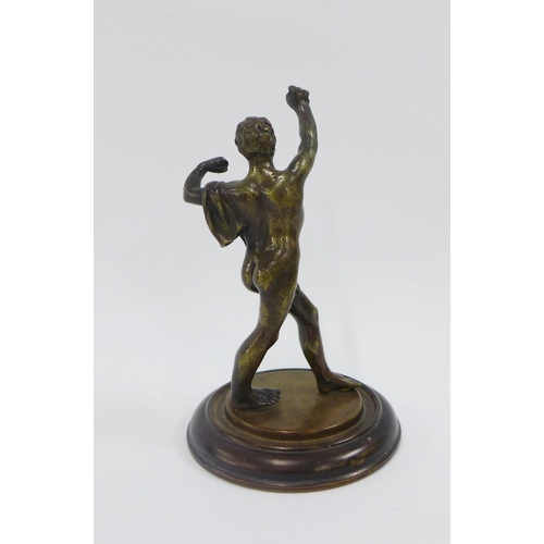 109 - Bronze figure of a classical male athlete, on a circular base (a/f) 16cm high
