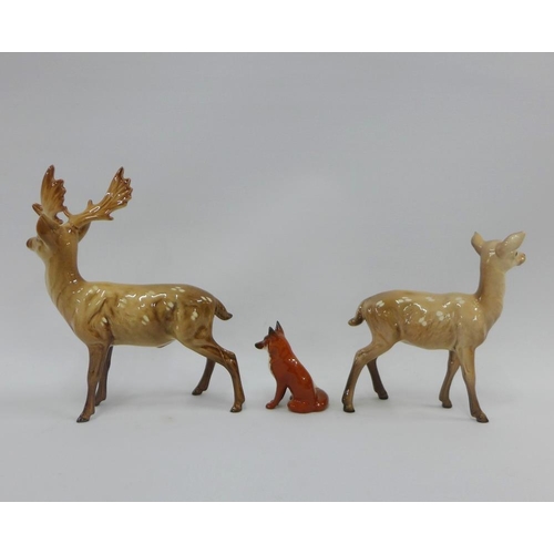 117 - Beswick stag and deer and a Beswick fox, tallest 20cm (3)